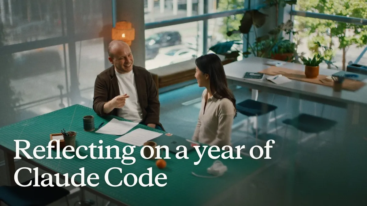 Two Anthropic team members talking across a table in the 'Reflecting on a year of Claude Code' video